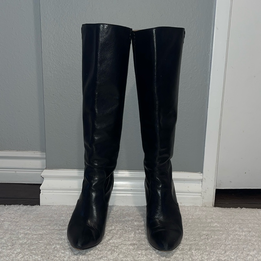 Frye Black Leather Boots with gold zipper and wood heel.